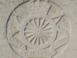Capbadge of the Army Cyclist Corps on a CWGC headstone