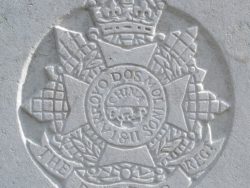 Capbadge of the Border Regiment on headstone